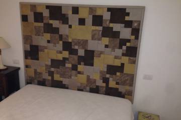 Testiera letto con mosaico in pelle Studio Art